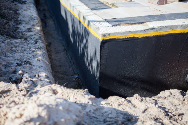 Professional Waterproofing technician working in Forest, OH